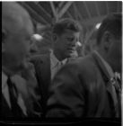 John F. Kennedy inside a tobacco warehouse